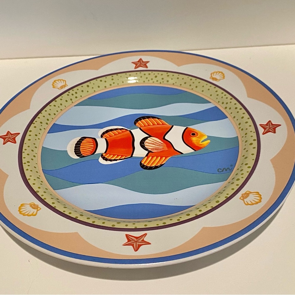 Set of four ceramic dishes with fish portraits